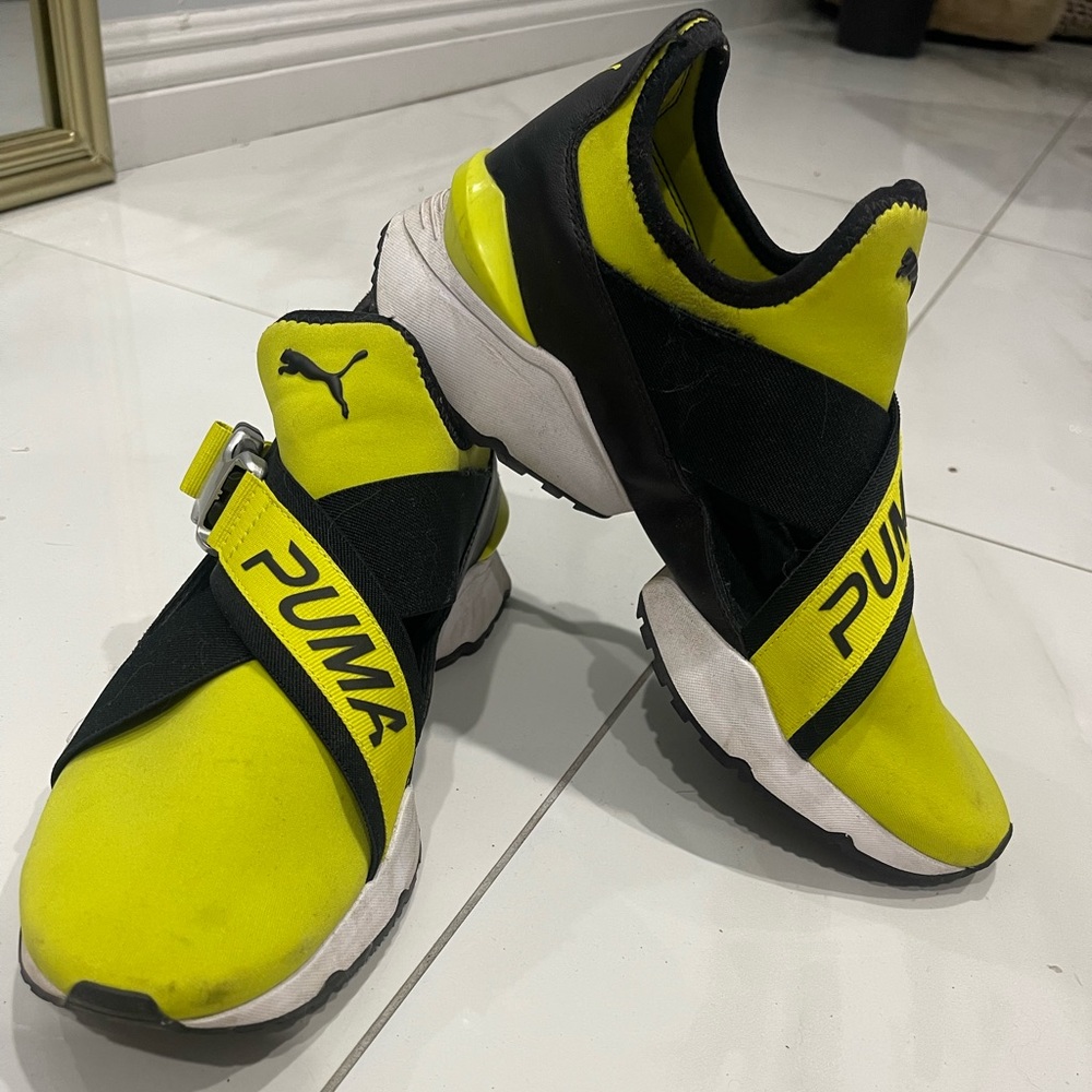 Yellow puma shoes
